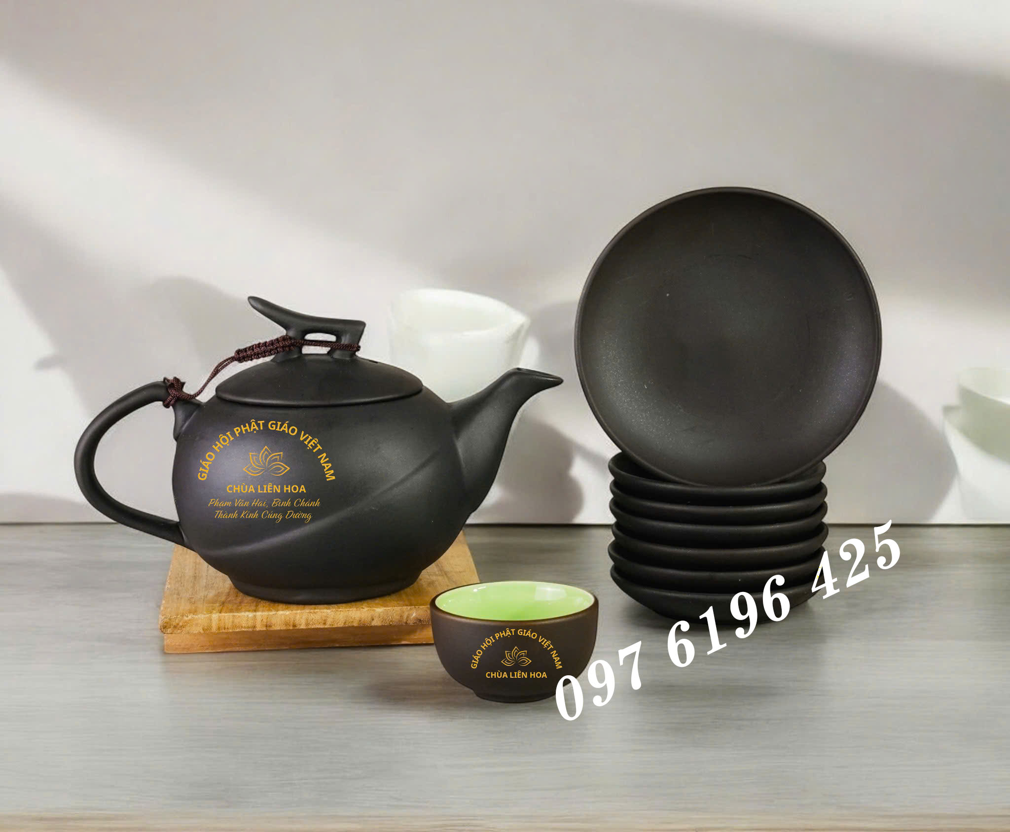 Bộ trà gốm đen in logo dáng quả cam